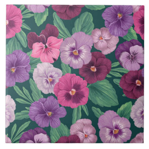 Colorful pansies on dark greenish blue tile