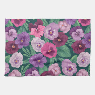 Colorful pansies on deep violet tea towel