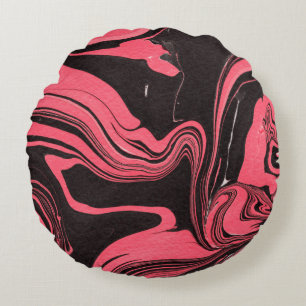 Colorful red marble ink paper textures on white ba round cushion