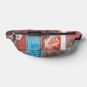 Colorful wall with blue door bum bags