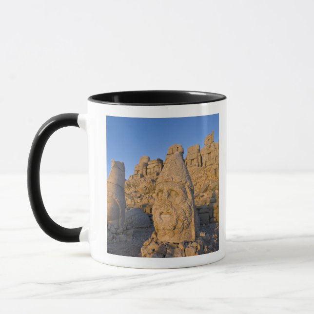 Colossal head statues of Gods guarding the Mug (Left)