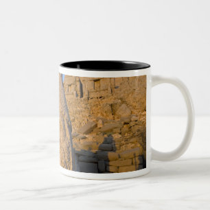 Colossal head statues of Gods guarding the Two-Tone Coffee Mug