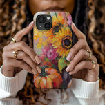 Colourful Autumn Floral and Pumpkins iPhone 15 Case<br><div class="desc">A vibrant, modern abstract painting showcasing a playful arrangement of pumpkins, sunflowers, and other fall foliage. Rich autumn hues like burnt orange, deep reds, pinks and golden yellows blend with soft brushstrokes and bold splashes of colour. The abstract style adds a contemporary flair to the traditional fall harvest theme, capturing...</div>