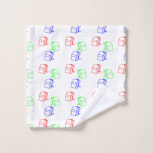 Colourful backpacks on white wash cloth