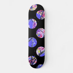 Colourful blue circles on black skateboard