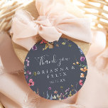 Colourful Blue Wild Floral Thank You Wedding Favou Classic Round Sticker<br><div class="desc">This colourful blue wild floral thank you wedding favour classic round sticker is perfect for a rustic wedding. The design features a yellow, purple, white wild flowers with foliage in a rose and green watercolor background. Make the sticker labels your own by including your names, the event (if applicable), and...</div>
