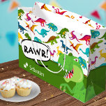 Colourful Dinosaur Pattern with Name T-Rex Green Large Gift Bag<br><div class="desc">Does your little boy or girl love dinosaurs? This birthday party gift bag is perfect! There's a big T-Rex saying RAWR, dinosaur footprints and your little kid's name on white, a green background, and a fun colourful dino pattern. This gift bag makes a great addition to your birthday celebration for...</div>