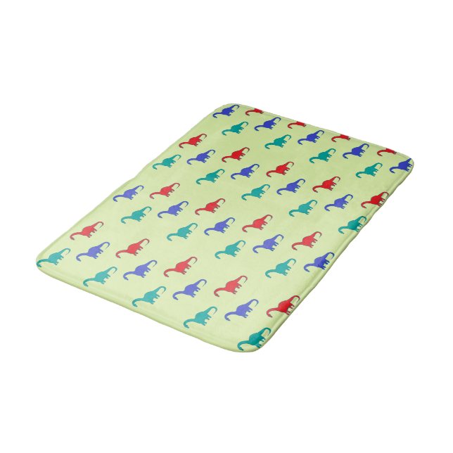 Colourful dinosaurs pattern on green bath mat (Angled)