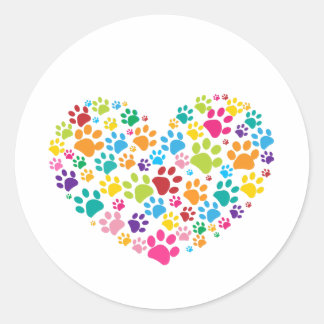 Colourful dog paw print made of heart classic round sticker