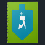 Colourful Dreidel w. Hebrew Letters Gimmel & Shin Notebook<br><div class="desc">Bright teal dreidel on green background with the Hebrew letter gimmel on one side and shin on the other for the celebrations of the Jewish holiday of Hanukkah. Traditionally, during the holiday of Chanukah, children (and often adults) play a safe-hazard game with a dreidel (or sevivon in modern Hebrew). On...</div>