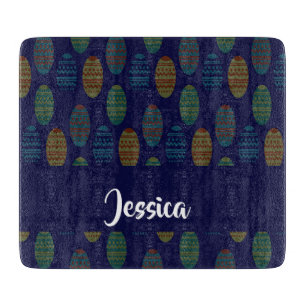 Colourful easter eggs on blue cutting board
