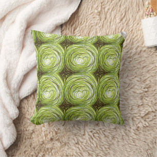 Colourful fabric design featuring green floral mot cushion