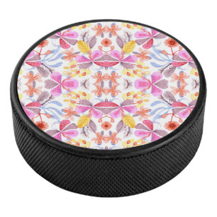 Colourful floral mandala design on a round hockey puck