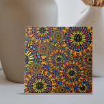 Colourful Floral Oriental Ethnic Mandalas Pattern Tile<br><div class="desc">This ceramic tile features elaborate mandala-like motifs with exquisite detail, providing a kaleidoscopic impression. The tile features two major patterns: one that resembles a dazzling sun and another made up of complicated layers of geometric figures arranged in circular configurations. Yellow, red, blue, and black dominate the colour palette, which is...</div>