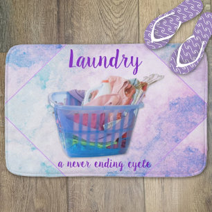 Colourful Folded Laundry On Hangers In Blue Basket Bath Mat