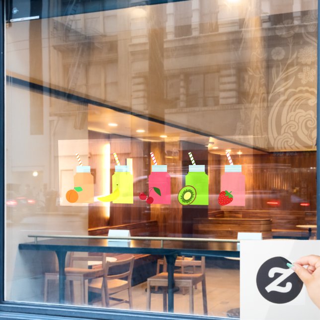 Colourful fruit juice bottles with straws (Cafe Window)