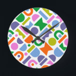 Colourful Geometric Shapes Round Clock<br><div class="desc">A colourful and modern design that features geometric cut-out shapes. This playful design is inspired by retro, mid-century modern style and would be great for the modern home, rec room, playroom or kid’s room. Colours included in this abstract pattern are; blue, purple, pink, green, yellow, pink and orange against a...</div>