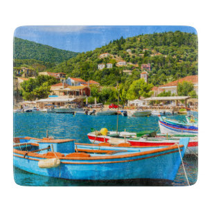 Colourful Greek fishing boats in port of Kioni Cutting Board