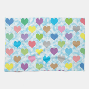 Colourful hearts pattern on blue background tea towel