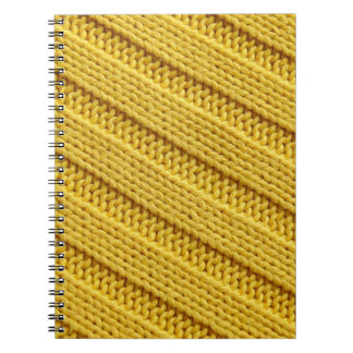 Colourful knitted textile texture. Yellow. Notebook