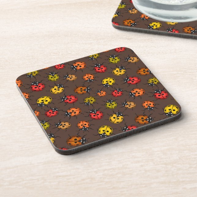 Colourful ladybugs on brown coaster (Left Side)