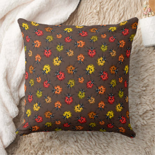 Colourful ladybugs on brown cushion