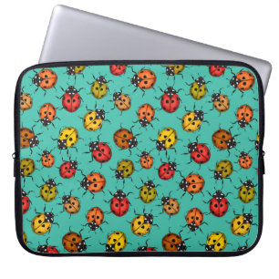 Colourful ladybugs on turquoise laptop sleeve