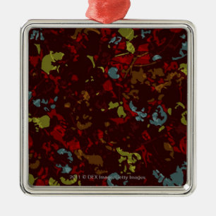 Colourful leaves and flowers against camouflage metal tree decoration