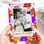 Colourful Merry and Bright Poinsettia Photo Holiday Card<br><div class="desc">Cute and colourful holiday photo card featuring a pattern of brightly coloured poinsettias in shades of red, orange, pink, and purple with a white background. "Merry and Bright" is displayed in trendy red-orange lettering. Personalise the front of the card by adding your vertical photo and name. The poinsettia holiday card...</div>
