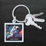 Colourful Modern Astronaut Space Personalised Name Key Ring<br><div class="desc">Colourful Modern Astronaut Space Personalised Name Keychain features an astronaut floating though outer space with colourful planets and swishes and personalised with your name in modern script typography. Perfect as a gift for space lovers, family and friends for birthday, Christmas, holidays, Father's Day, brother, husband, partner, best friends, work colleagues...</div>