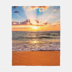 Colourful ocean beach sunrise with deep blue sky a fleece blanket
