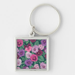 Colourful pansies on dark greenish blue key ring