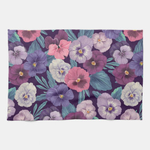 Colourful pansies on deep violet tea towel