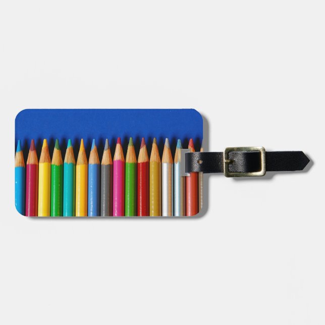 Colourful pencil crayons on blue background luggage tag (Front Horizontal)