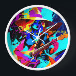 Colourful Pop Art Guitarist Witch Clock<br><div class="desc">The image features a witch playing an electric guitar, portrayed in a vibrant and colourful art style. The witch wears a large, wide-brimmed hat and has flowing, wavy hair in hues of yellow and blue. Her expression is focused and intense as she strums the guitar, which stands out with its...</div>