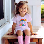 Colourful Rainbow Sunshine Birthday Kids T-Shirt<br><div class="desc">Make the birthday star shine with this cheerful rainbow and sunshine birthday tee featuring vibrant multicolor typography and a playful illustrated rainbow with clouds. The name, age, and birthday number are all fully customisable, making it a keepsake-worthy addition to the celebration. A bright and joyful choice for rainbow-themed birthday parties...</div>