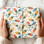 Colourful Retro Christmas Lights Wrapping Paper<br><div class="desc">Brighten up your holiday gifts with this cheerful retro Christmas lights wrapping paper! Featuring hand-drawn strings of colourful vintage bulbs in red, green, blue, and gold with sparkling star accents, this design adds a festive and nostalgic touch to your presents. Perfect for Christmas, holiday parties, Secret Santa, or any seasonal...</div>