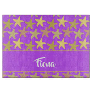Colourful starfish on purple cutting board