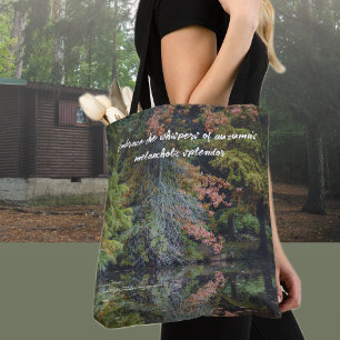 Colourful trees reflecting upon the calm water tote bag