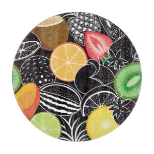 Colourful tropical fruits, black background. cutting board