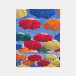 Colourful umbrellas in the sky blue orange red fleece blanket