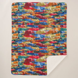 Colourful umbrellas in the sky blue orange red sherpa blanket