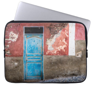 Colourful wall with blue door laptop sleeve