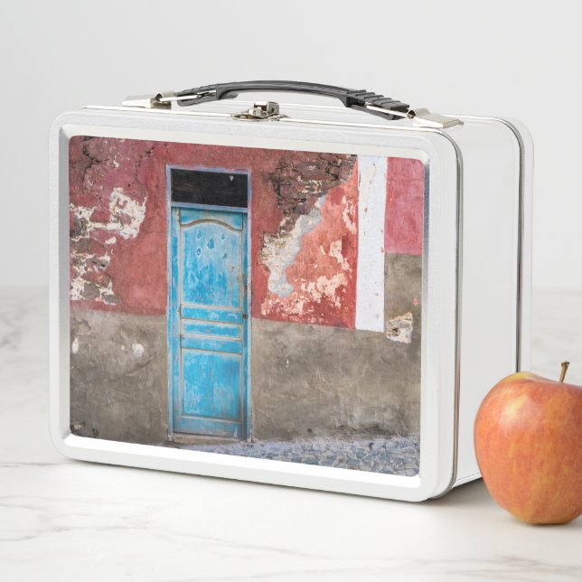 Colourful wall with blue door metal lunch box (In Situ)
