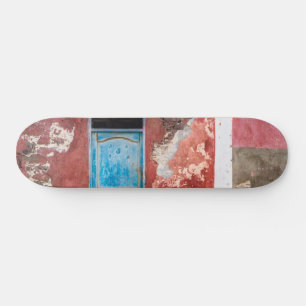 Colourful wall with blue door skateboard