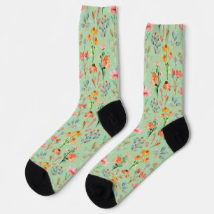 Colourful wildflowers in watercolor on green socks