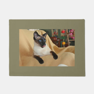 Comical Seal Point Siamese Cat Licking It's Nose Doormat