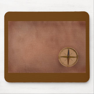 compass on old paper mouse pad