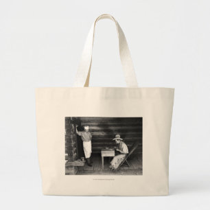 Cook watching a cowboy play cards large tote bag