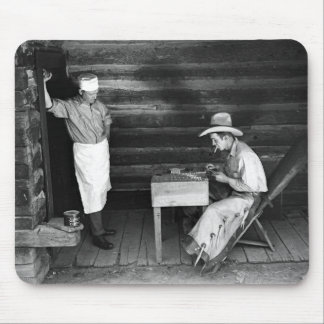 Cook watching a cowboy play cards mouse pad